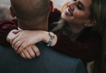 Refresh Your Profile: The Guide to Better Hookup Matches man in black suit jacket kissing woman in red shirt