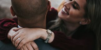 Refresh Your Profile: The Guide to Better Hookup Matches man in black suit jacket kissing woman in red shirt