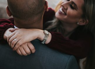 Refresh Your Profile: The Guide to Better Hookup Matches man in black suit jacket kissing woman in red shirt