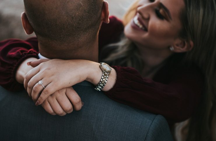 Refresh Your Profile: The Guide to Better Hookup Matches man in black suit jacket kissing woman in red shirt